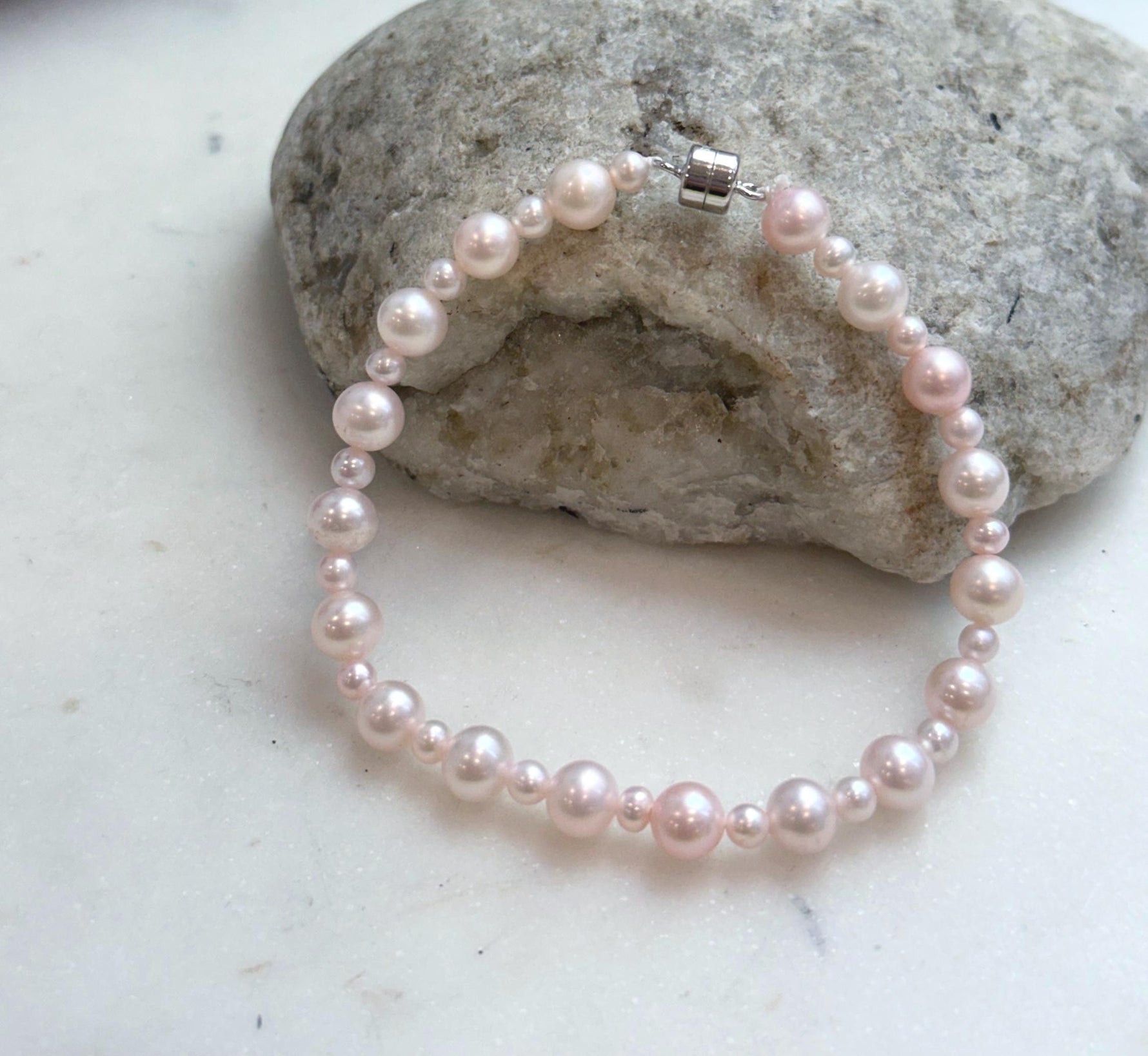 Genuine pale pink pearl bracelet with graduated 3.5–6.5mm freshwater pearls and S925 sterling silver.