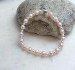 5. 5–6.5mm graduated pink pearl bracelet made with genuine freshwater pearls and sterling silver.