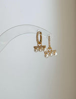 Elegant sterling silver pearl hoops for everyday wear.