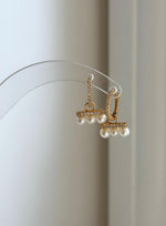 Dainty white pearl earrings with genuine freshwater pearls.