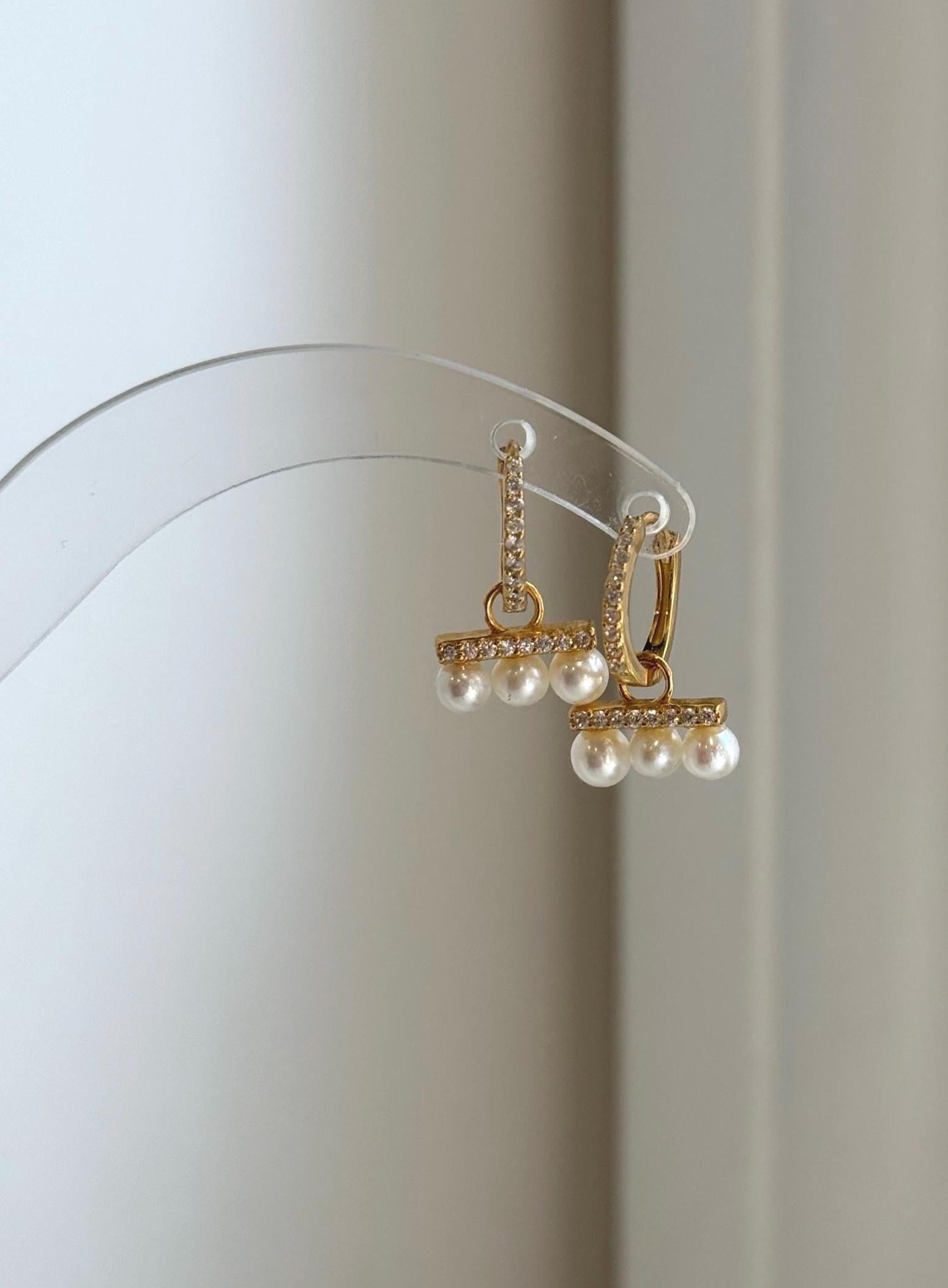 Dainty white pearl earrings with genuine freshwater pearls.