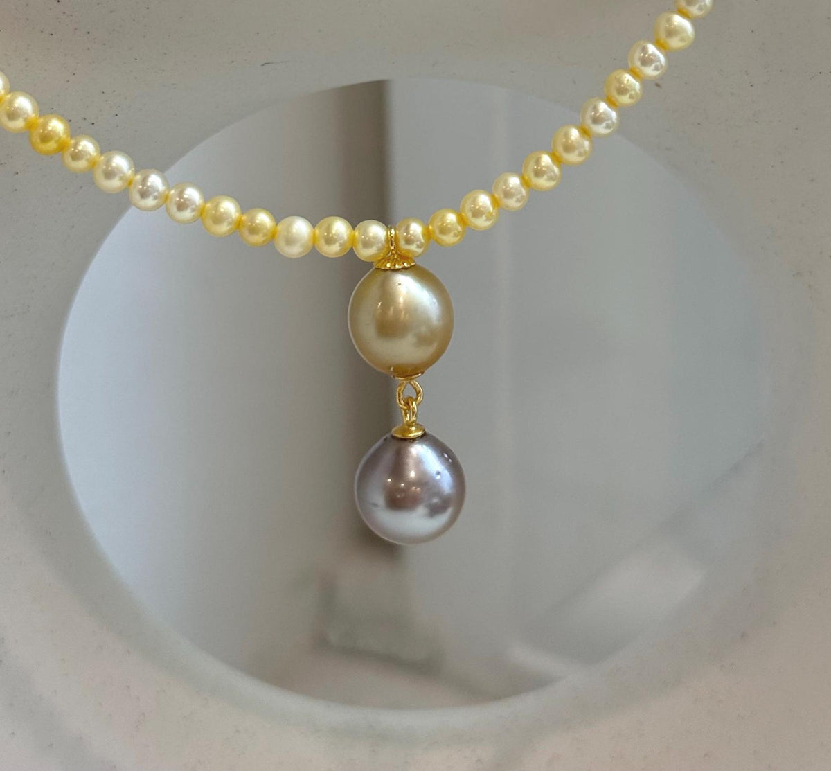 Golden freshwater pearl necklace paired with Tahitian and South Sea golden pearl pendant.