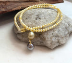 9.8–10.4mm genuine Tahitian and South Sea golden pearls in a unique drop pendant design.