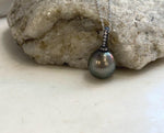 Tahitian pearl necklace featuring a large 12.7mm hunter green pearl.