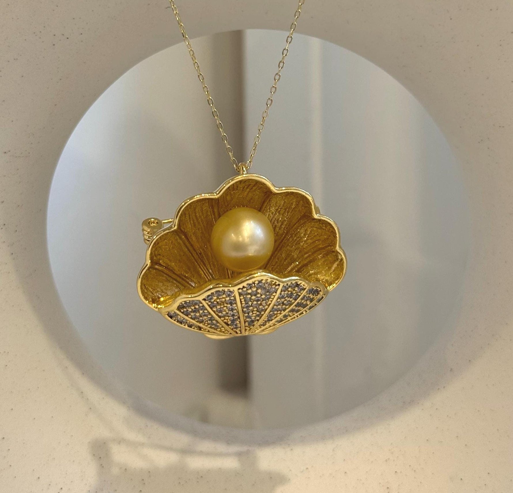 Natural ultra golden South Sea pearl with exceptional mirror-like shine.
