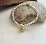 Elegant double pearl bracelet featuring natural golden South Sea pearls with radiant mirror-like luster.