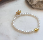 Luxury golden pearl jewelry featuring matched 8.5–8.8mm South Sea pearls in a modern bracelet design.