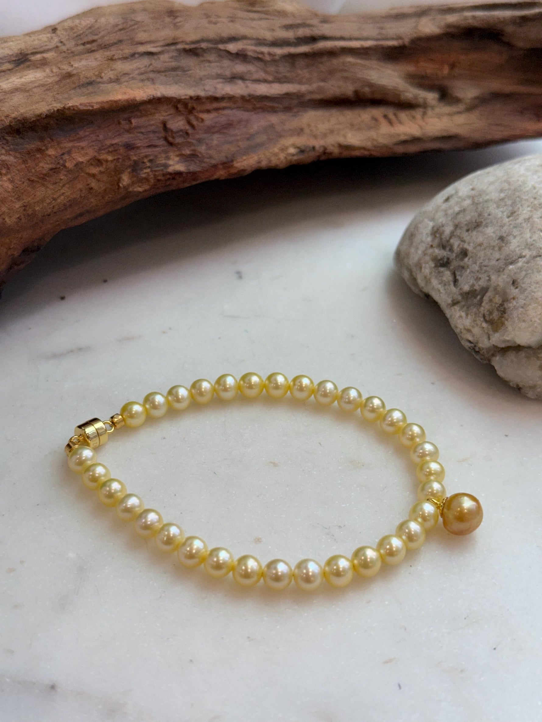 Genuine South Sea golden pearl bracelet featuring rich deep tea gold color and high shine.