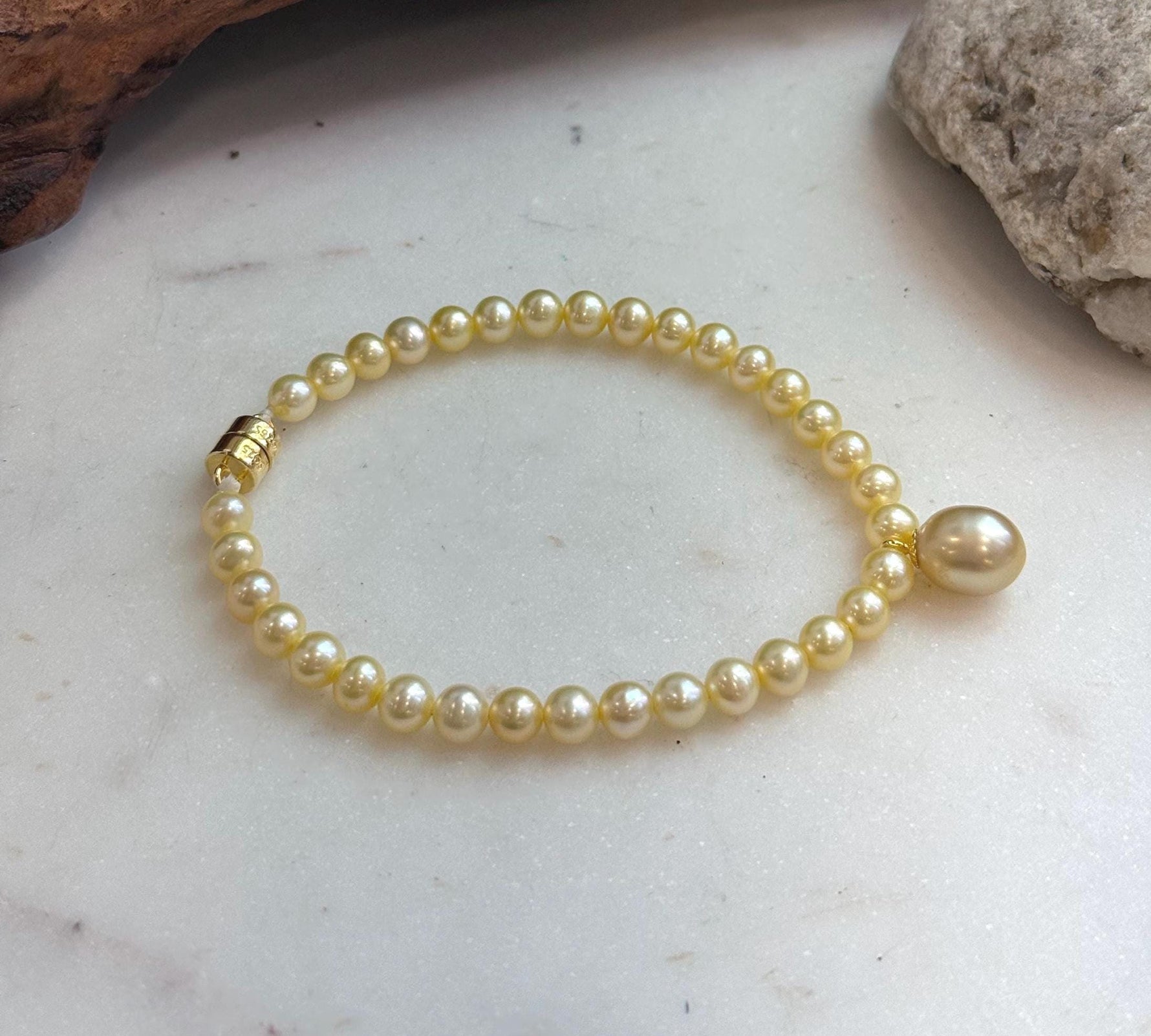 Genuine 9.1mm South Sea golden saltwater pearl bracelet in a rich deep tea gold color.