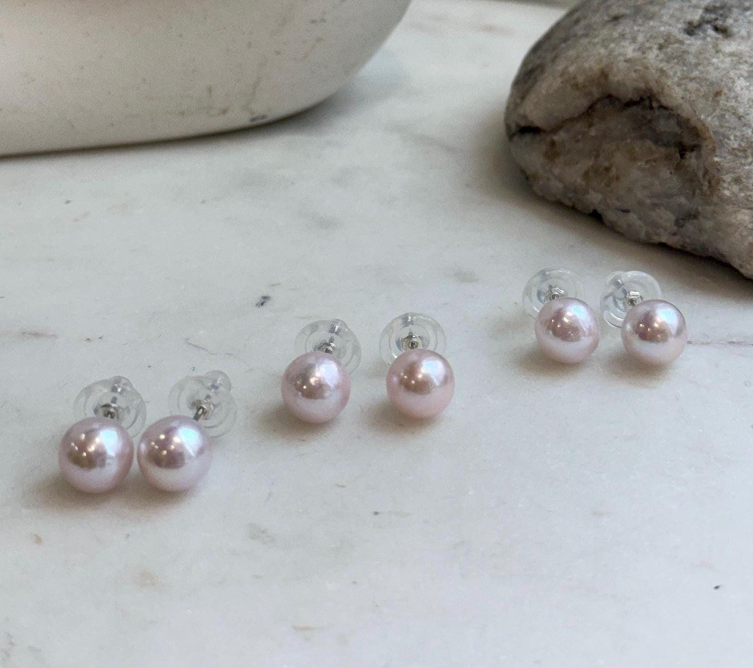 Genuine freshwater Edison pearl earrings featuring elegant pale pink color and high mirror-like luster.