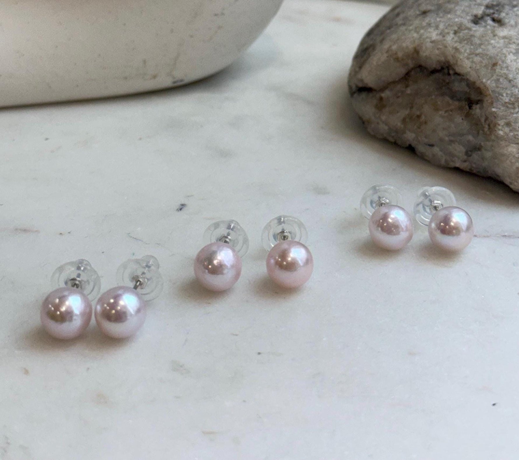 Genuine freshwater Edison pearl earrings featuring elegant pale pink color and high mirror-like luster.