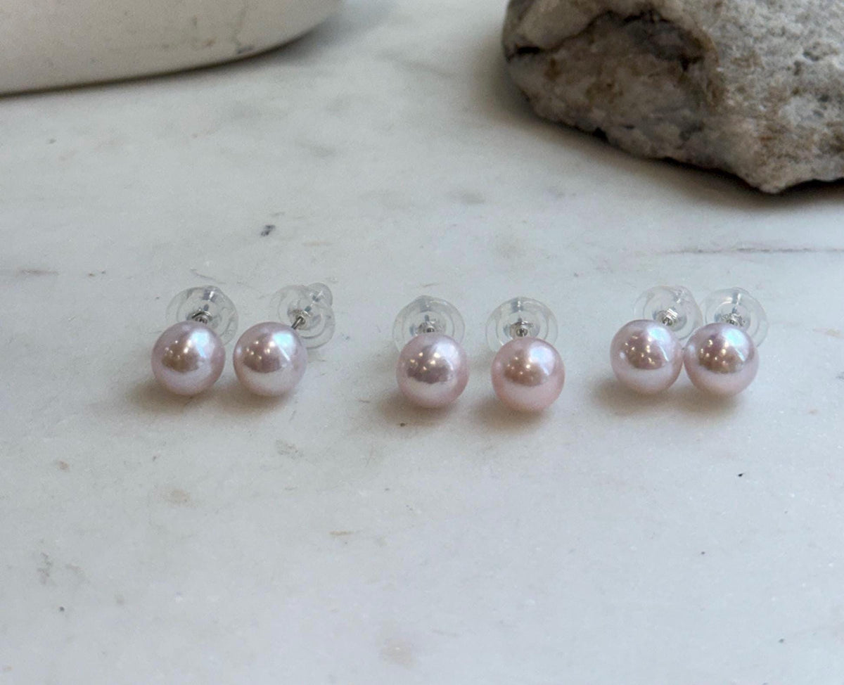 Close-up of 9.5mm pale pink Edison pearls showing their beautiful natural color and reflective luster.
