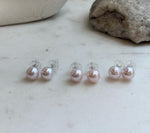 9.5mm Edison pale pink pearl stud earrings with beautiful mirror luster and S925 sterling silver settings.