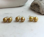 Elly’s 11.3mm Edison golden pearl stud earrings with beautiful mirror luster and S925 sterling silver settings.