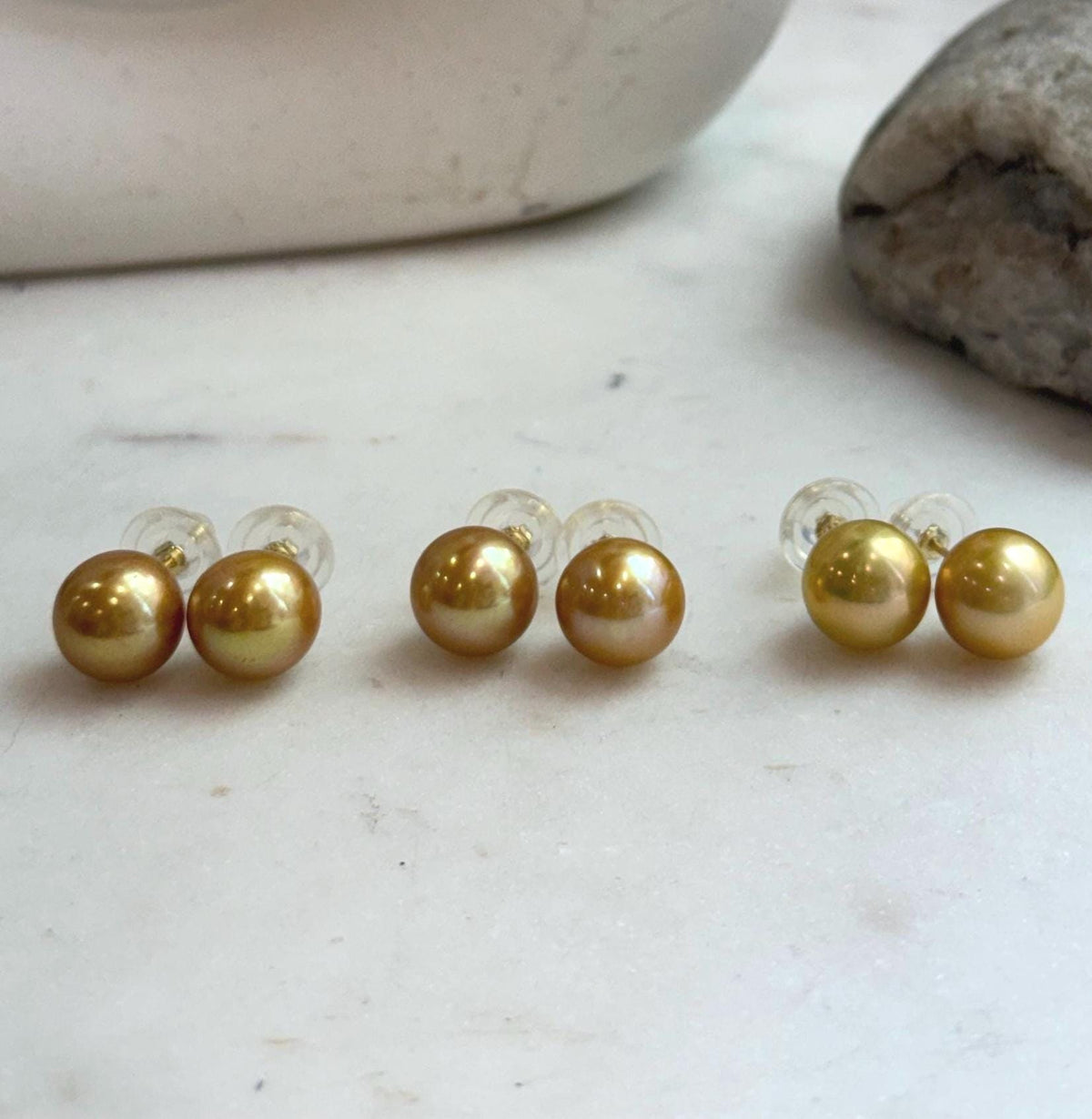 Elegant freshwater golden pearl stud earrings set in S925 sterling silver for a classic minimalist look.