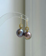 Close-up of rose gold lavender Edison pearls showing extreme luster and smooth reflective surfaces.