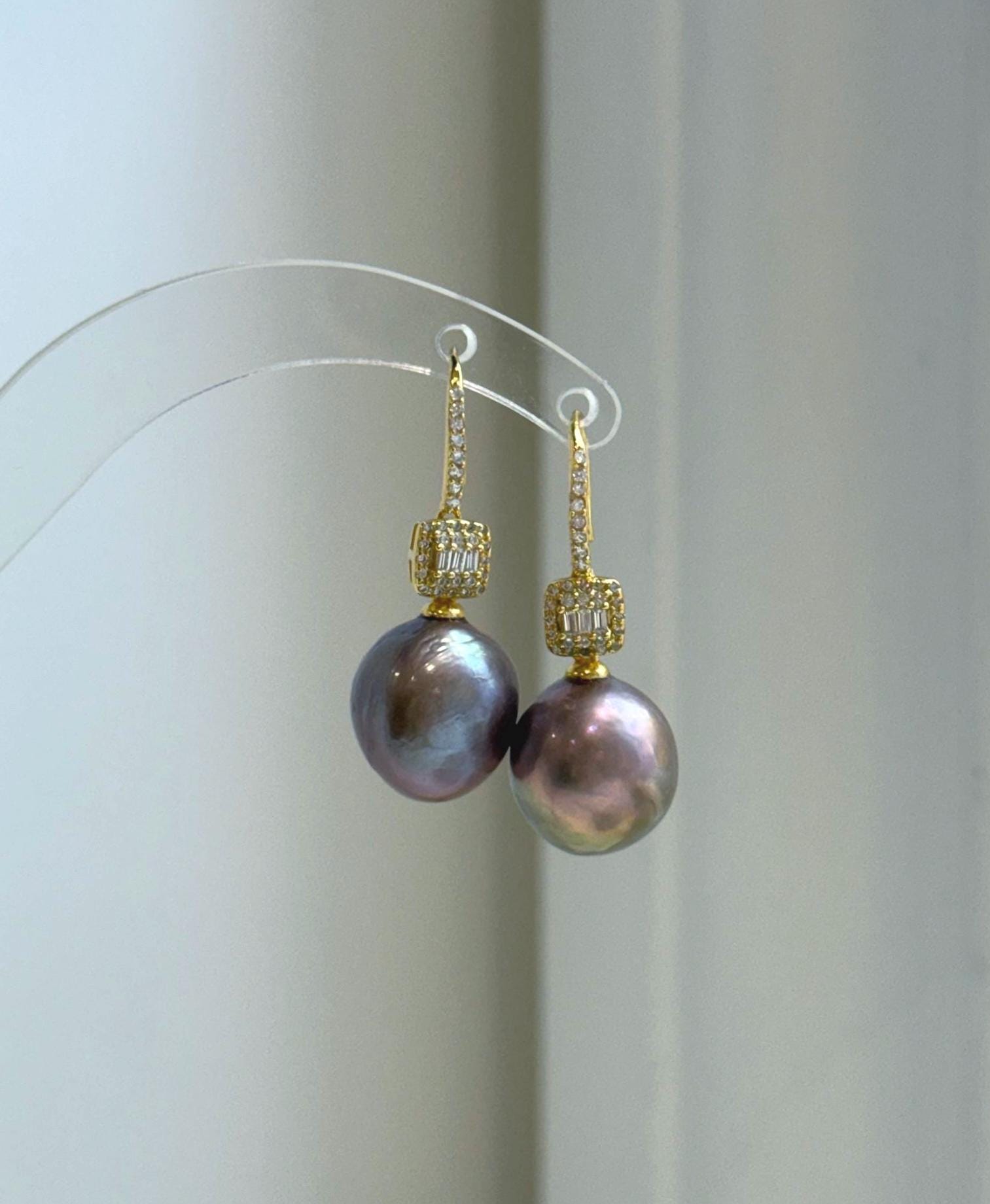 Close-up of rose gold lavender Edison pearls showing extreme luster and smooth reflective surfaces.