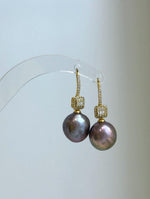 Elegant freshwater pearl hook earrings measuring approximately 3.3–3.5cm high.