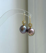 Statement 13.2mm pearl earrings with luminous mirror luster and minimalist silver hooks.