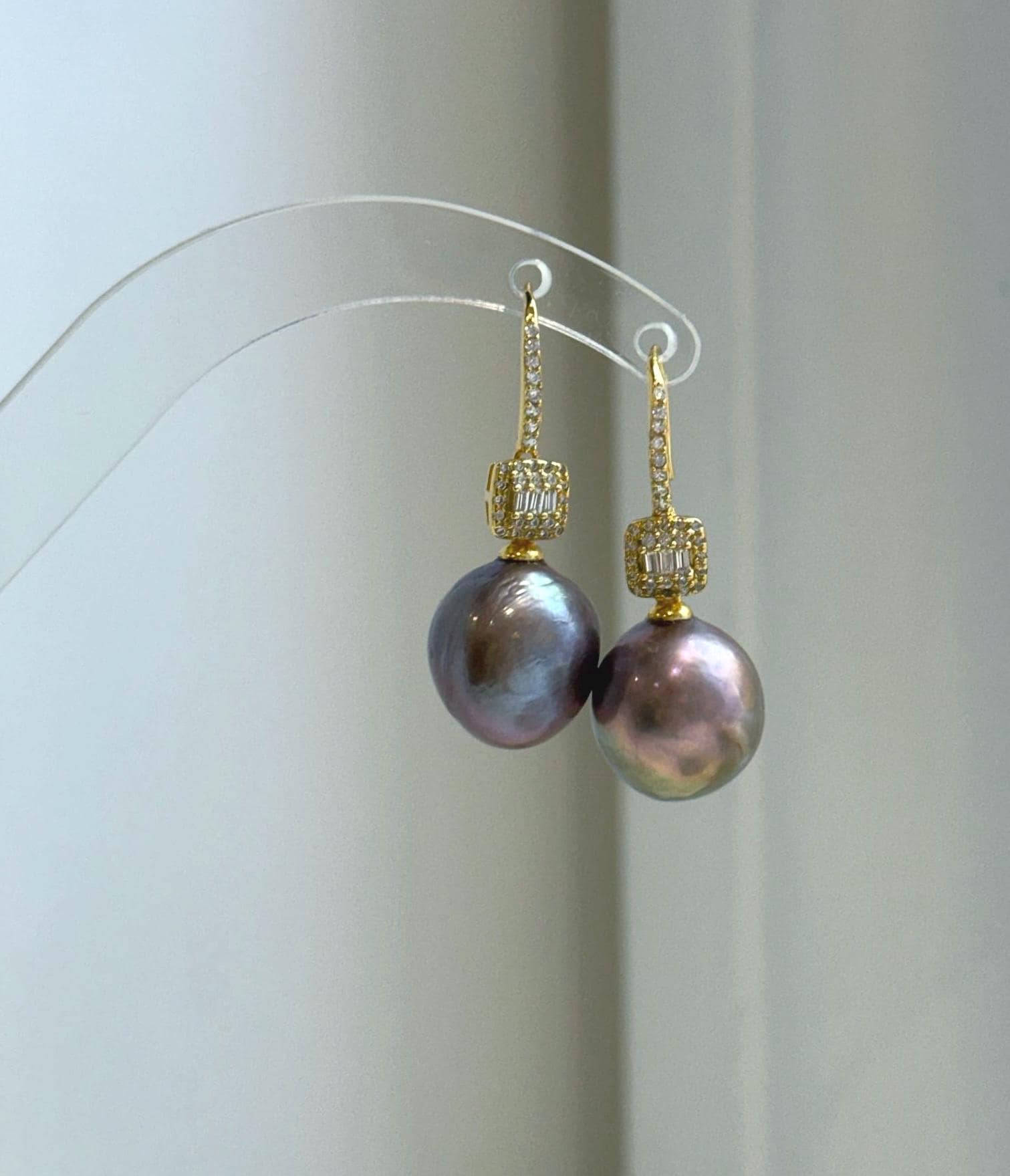 Statement 13.2mm pearl earrings with luminous mirror luster and minimalist silver hooks.