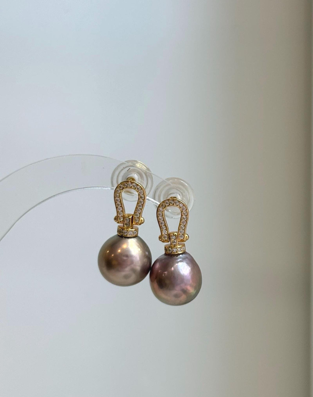 Genuine freshwater Edison pearl earrings featuring beautiful rose gold color and intense luster.