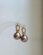 Genuine freshwater Edison pearl earrings featuring beautiful rose gold color and intense luster.