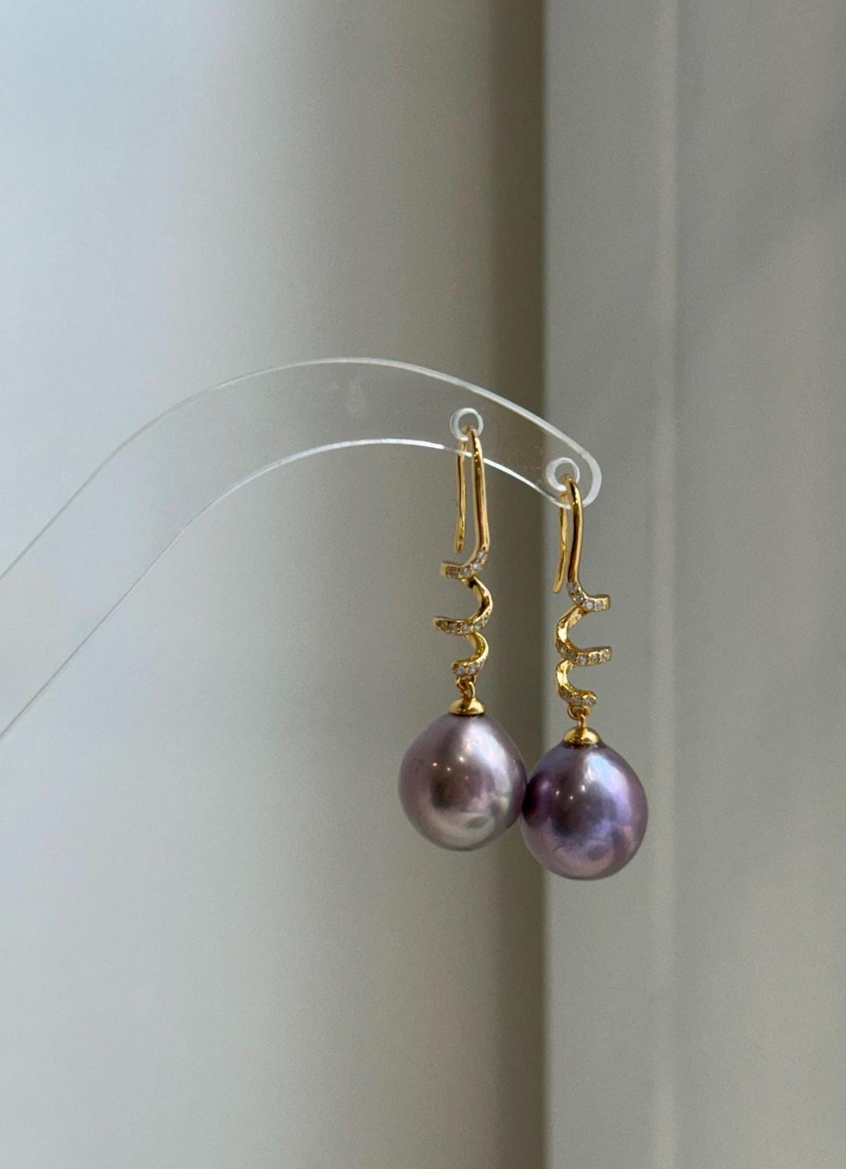 Genuine freshwater pearl hook earrings in a sophisticated rose lavender shade.