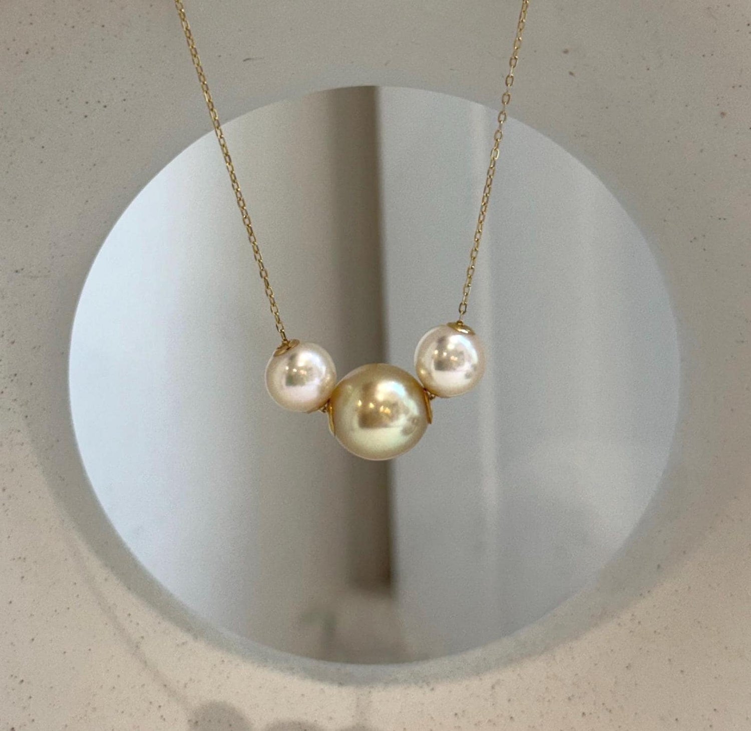 18K gold floating pendant featuring three genuine South Sea Golden and Akoya saltwater pearls.