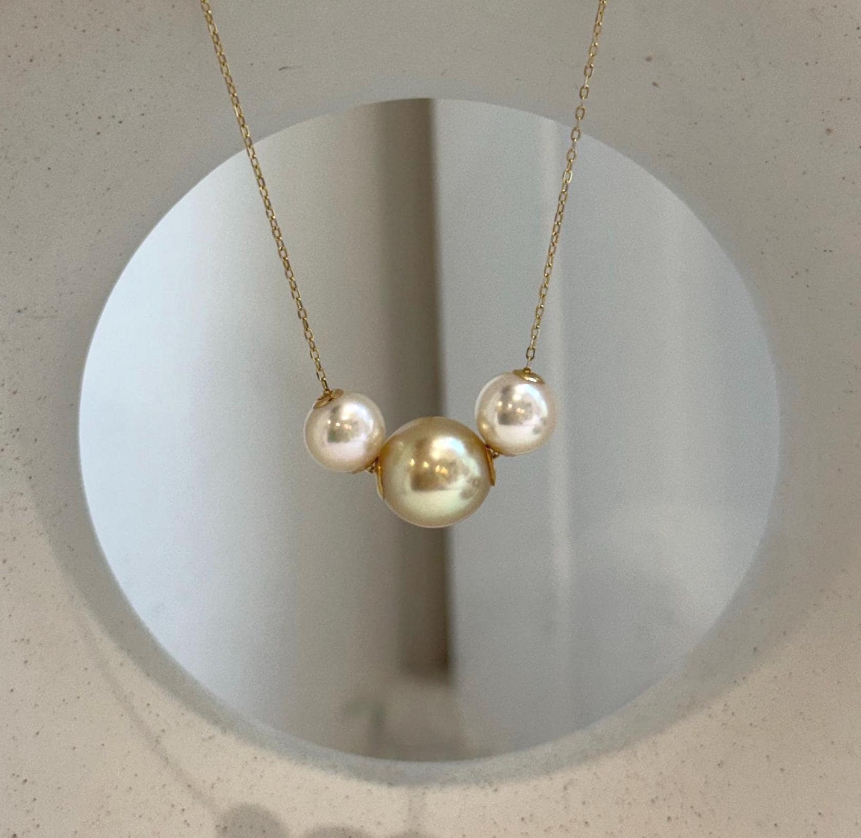 18K gold floating pendant featuring three genuine South Sea Golden and Akoya saltwater pearls.