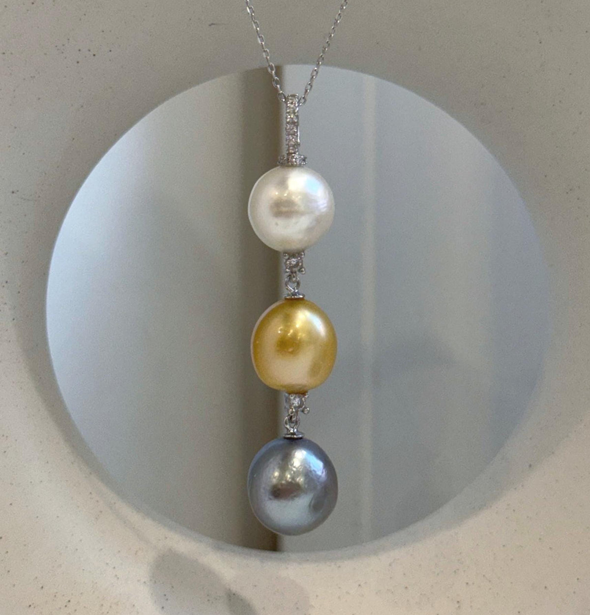 Luxury tri-pearl necklace with South Sea Golden, Tahitian, and Australian White pearls.
