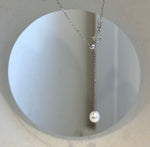 Luxury handcrafted pearl lariat necklace with genuine saltwater and freshwater pearls.
