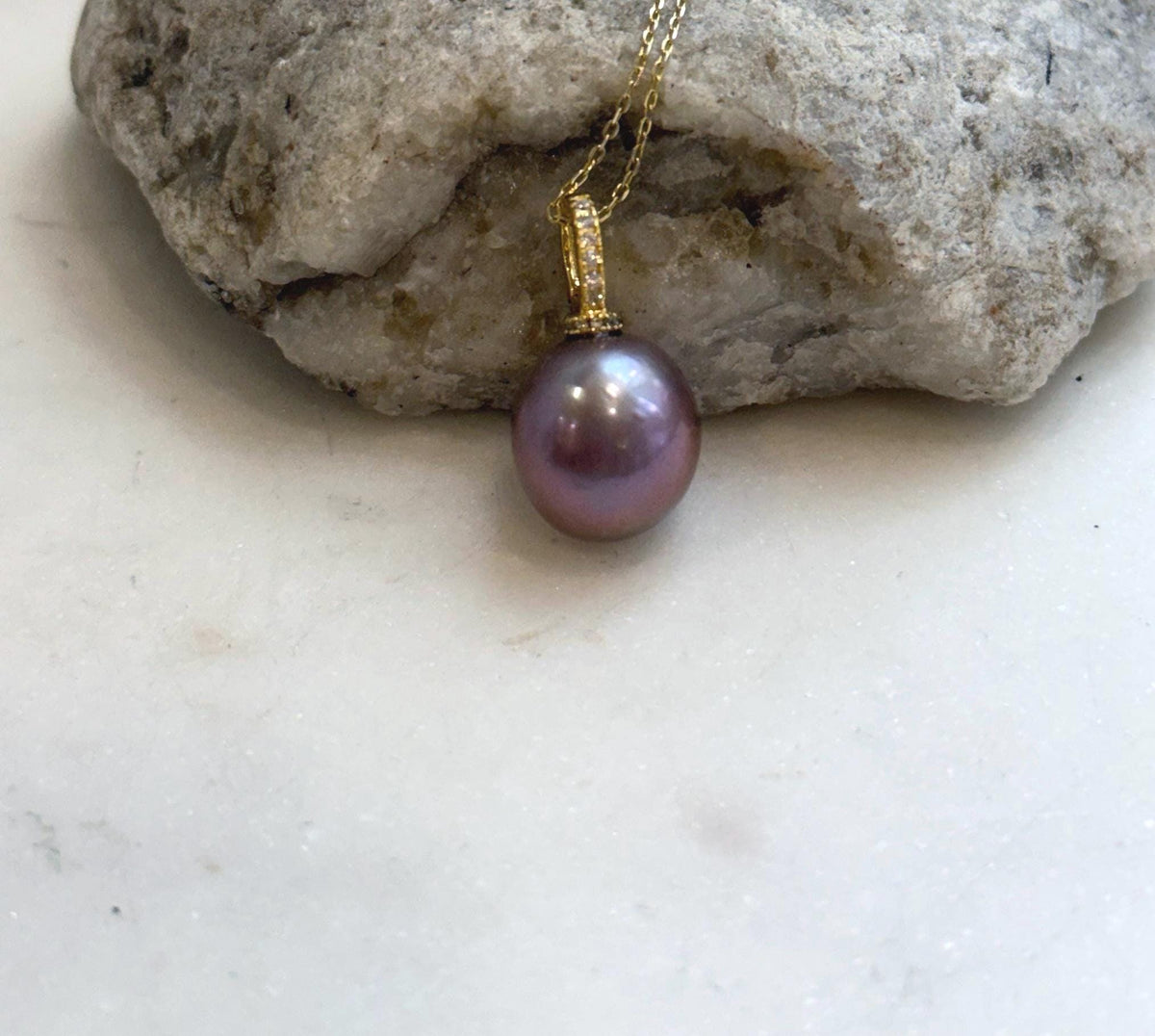 Close-up of 13.6mm lavender rose Edison pearl showing its extreme luster and rich natural color.