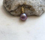 Close-up of 13.6mm lavender rose Edison pearl showing its extreme luster and rich natural color.