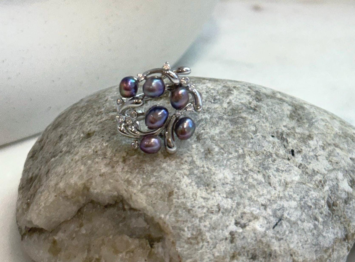 Adjustable S925 sterling silver ring featuring six purple Keshi pearls.