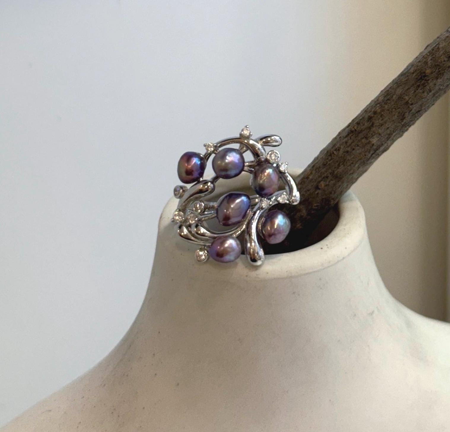 Luxury floral sterling silver ring with genuine freshwater pearls.