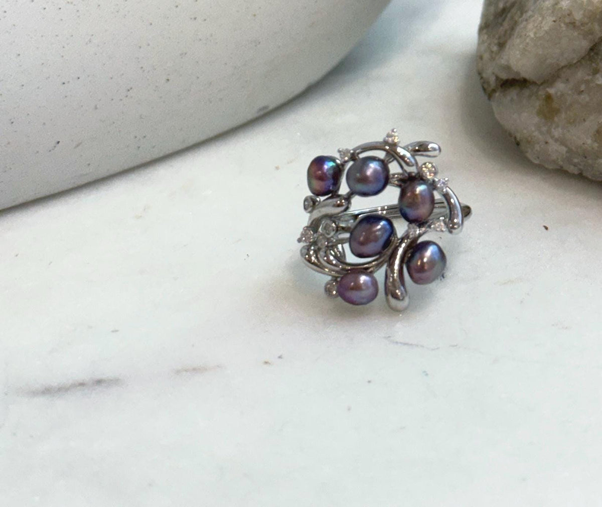Luxury floral sterling silver ring with genuine freshwater pearls.