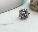Luxury floral sterling silver ring with genuine freshwater pearls.
