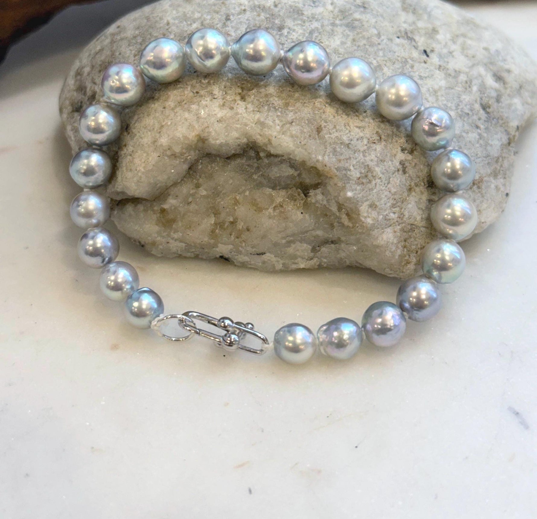 Luxury saltwater pearl bracelet handcrafted with 21 genuine Akoya pearls.