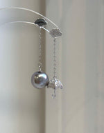 Close-up of 10.7mm platinum Tahitian pearls