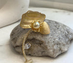 Genuine 10mm South Sea golden pearl centerpiece with rich deep tea golden color.