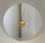 Close-up of extreme mirror luster on 11.5mm Edison golden pearl
