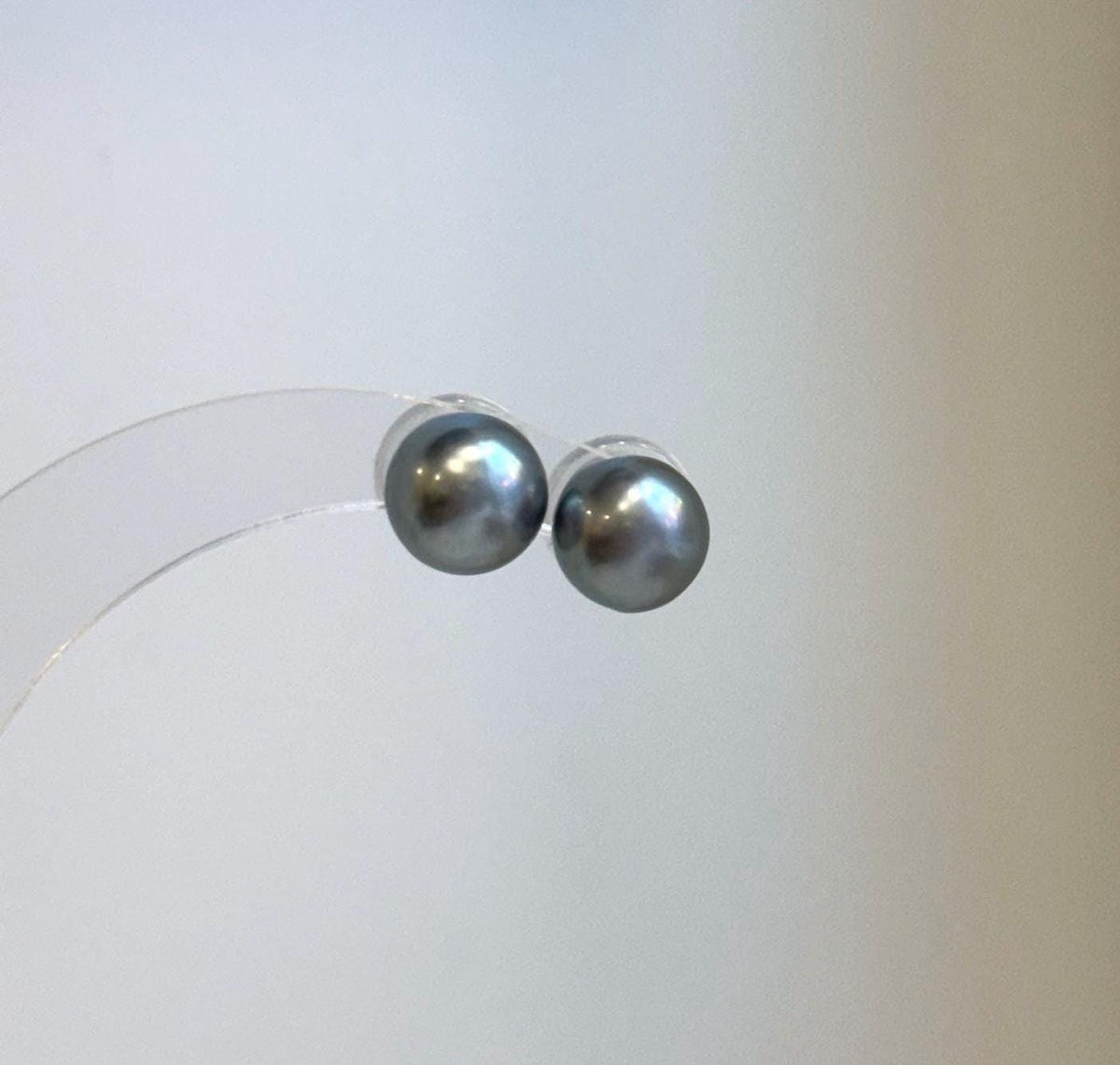 Round Tahitian pearl stud earrings in natural platinum color