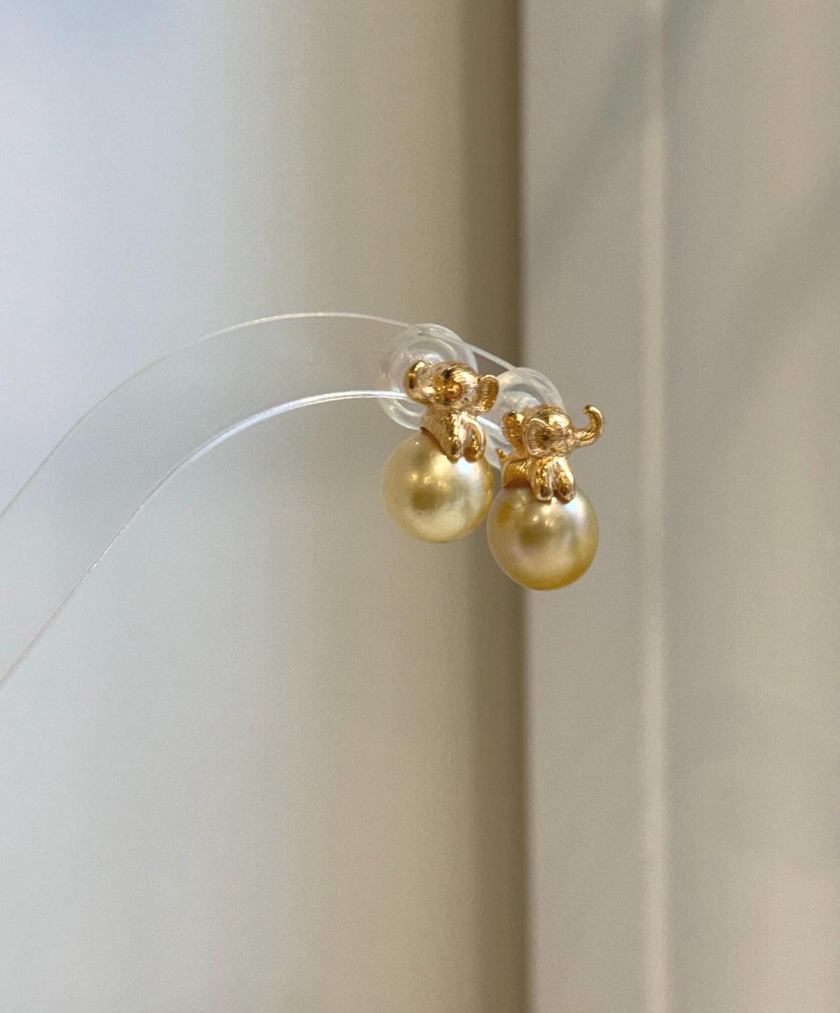 Mirror luster South Sea golden pearl elephant earrings close-up