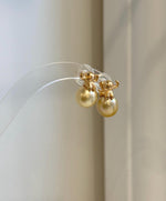 Mirror luster South Sea golden pearl elephant earrings close-up