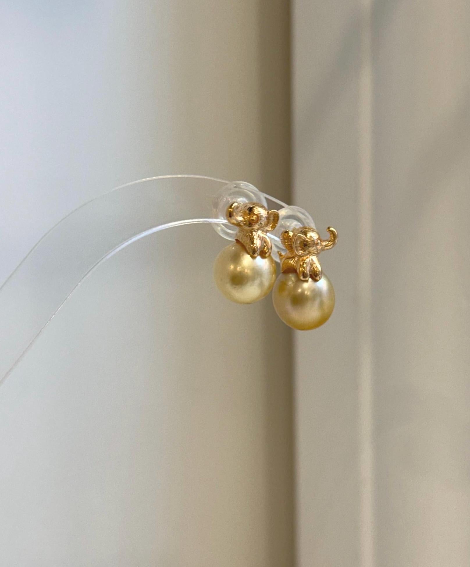 Mirror luster South Sea golden pearl elephant earrings close-up