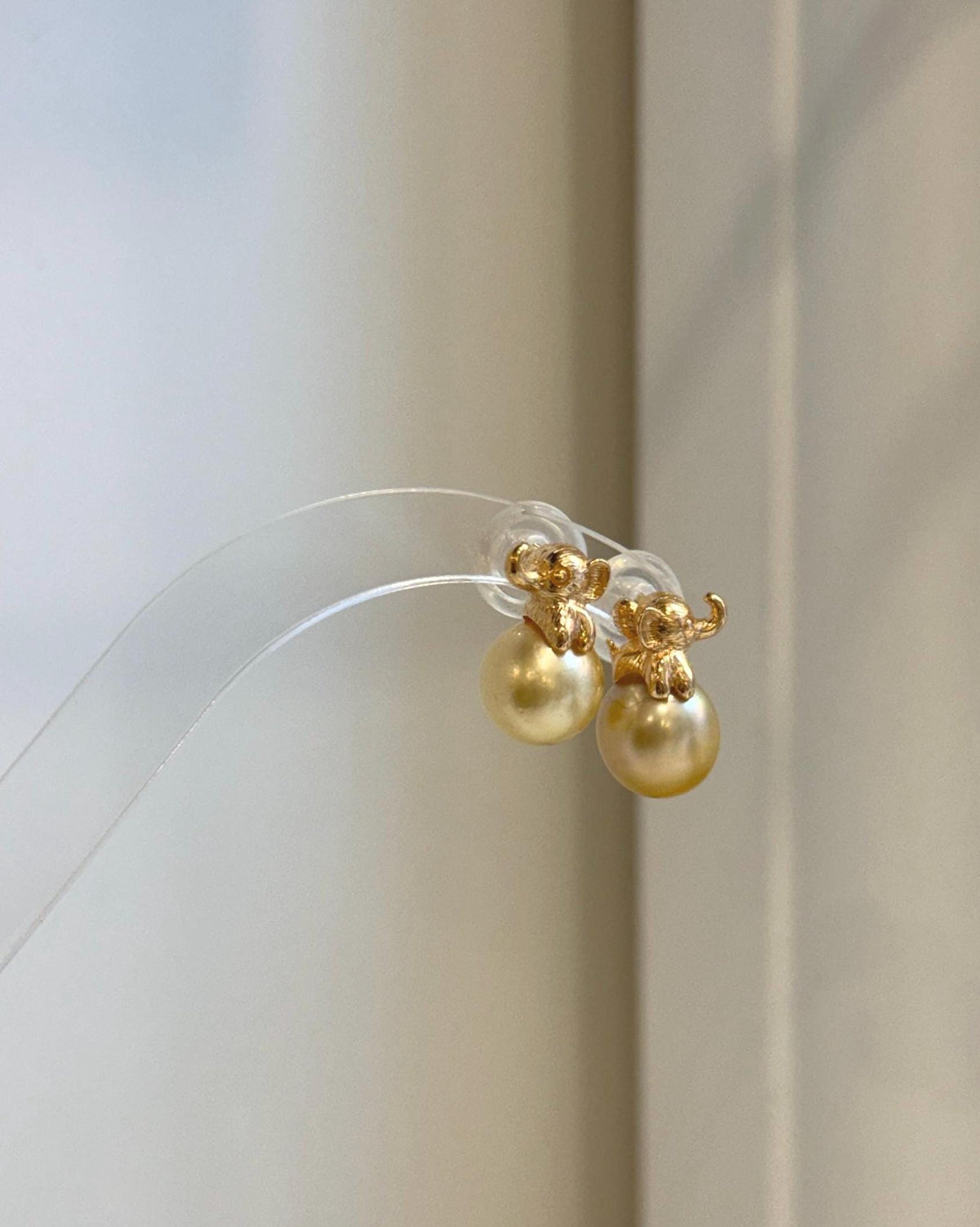 Handmade golden pearl elephant earrings with exceptional luster