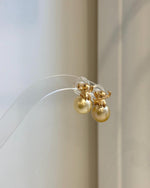 Handmade golden pearl elephant earrings with exceptional luster