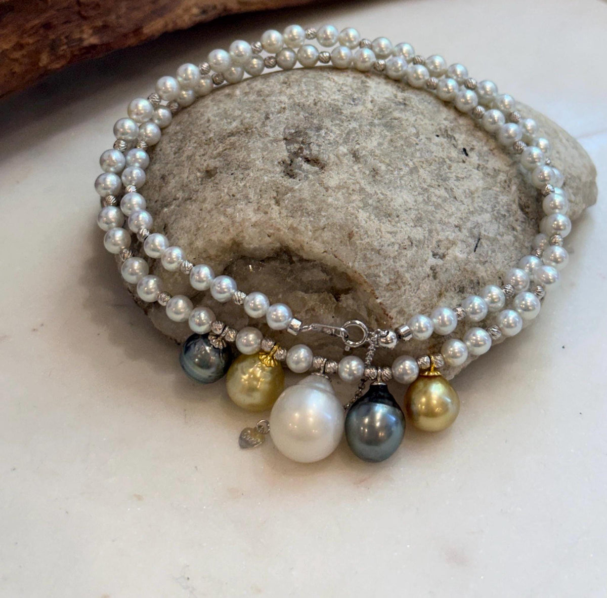 Fine jewelry necklace with natural saltwater pearls and silver clasp