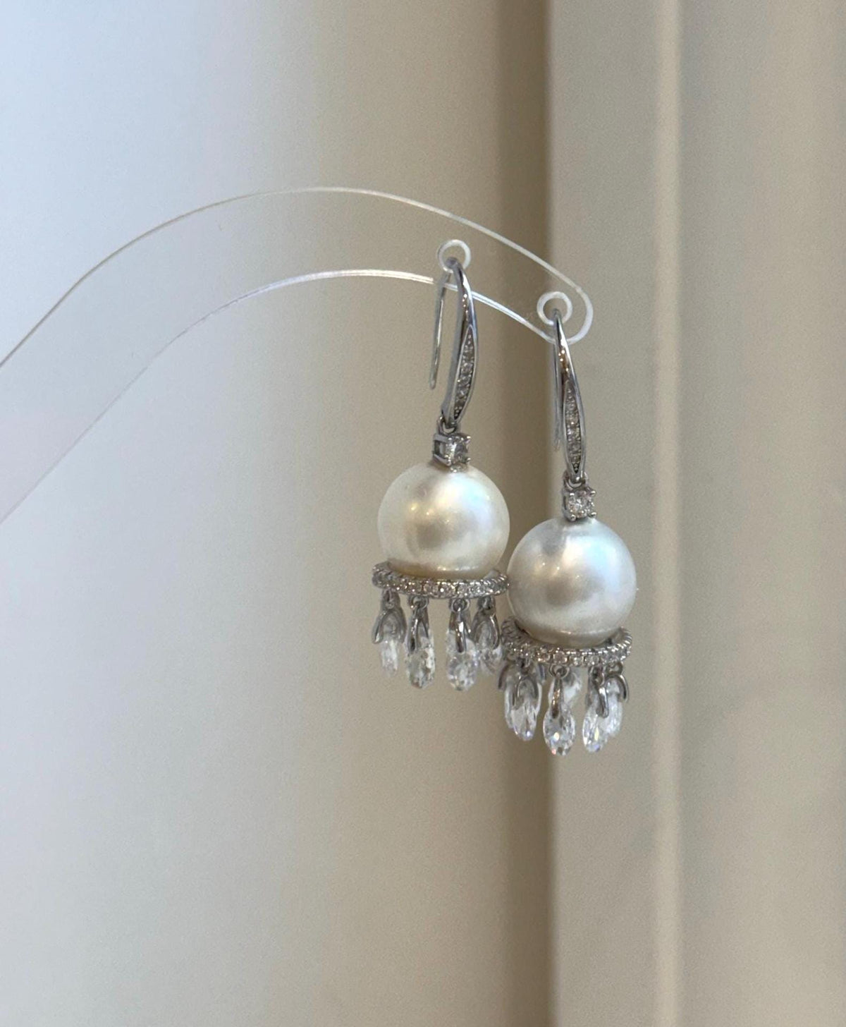 Elegant sterling silver hook earrings with genuine white pearls
