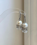 Elegant sterling silver hook earrings with genuine white pearls
